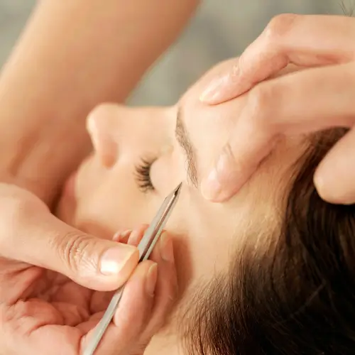 Brow shaping and waxing service for clean, defined arches with a polished look